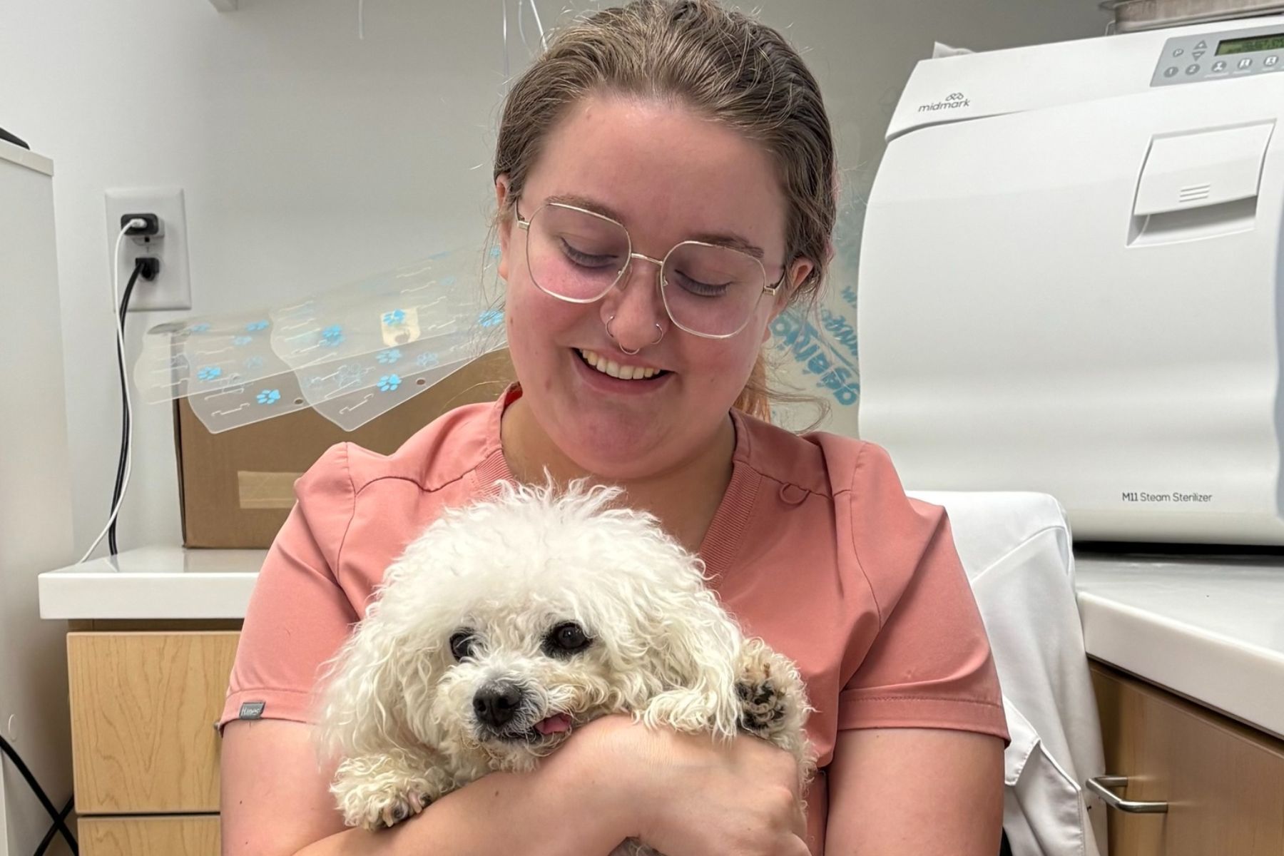 a lady holding a dog
